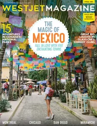 WestJet Magazine cover image, May 2017 edition, of a woman walking down a cobblestone road